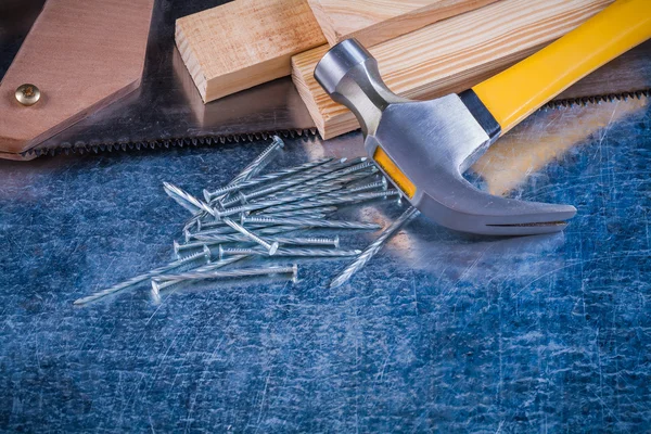 Nails, hammer, wooden bricks, hacksaw — Stock Photo, Image