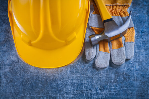 Safety gloves, building helmet and hammer