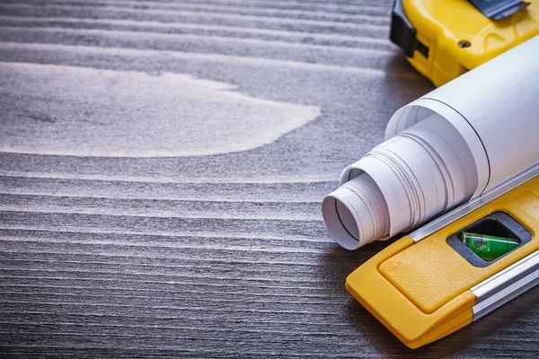 Measuring tape, blueprints and construction level — Stock Photo, Image