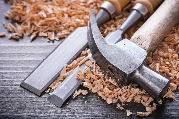 Claw hammer and metal firmer chisels — Stock Photo, Image