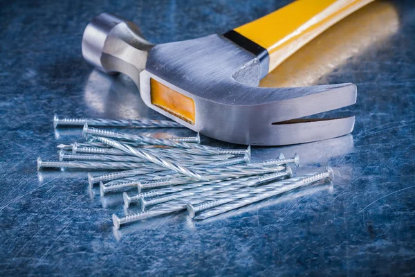 Stainless construction nails with claw hammer — Stock Photo, Image