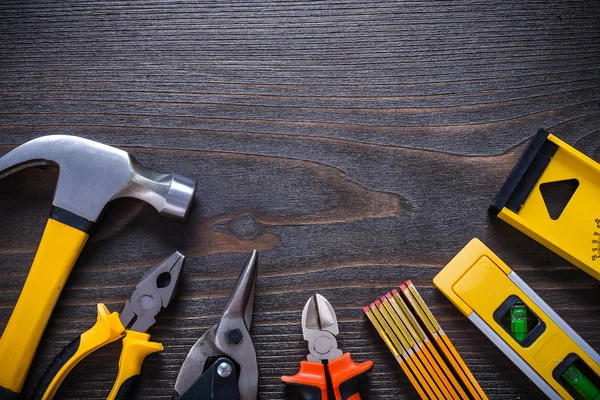 Gripping tongs nippers tin snips claw hammer try square construc