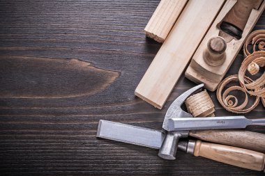 hammer, metal chisels and curled shavings clipart