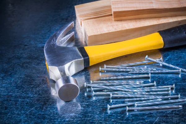 Stainless nails, hammer and wooden bricks — Stock Photo, Image