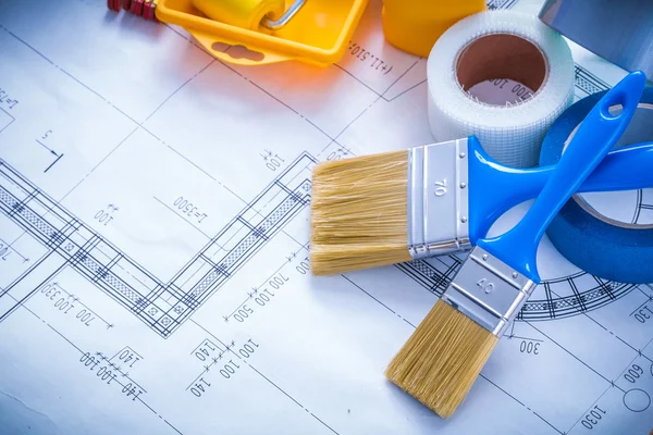 Blueprint with paint roller tray and  brushes — Stock Photo, Image