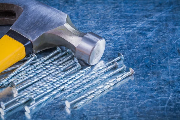 Construction nails with claw hammer — Stock Photo, Image