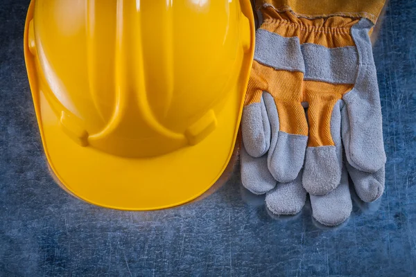 Helmet and safety working gloves Stock Image