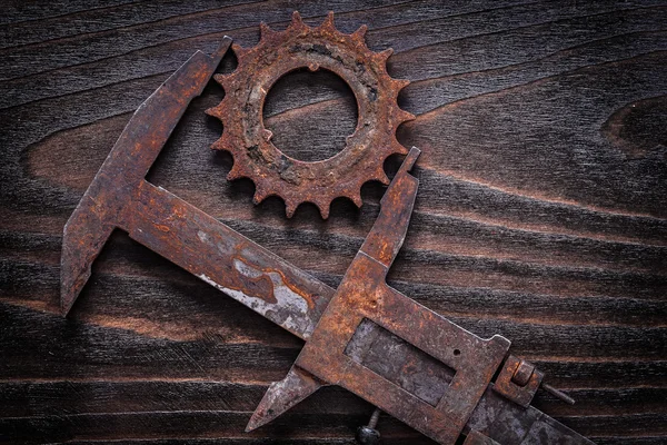 Rusted measuring caliper with gear wheel — Stock Photo, Image