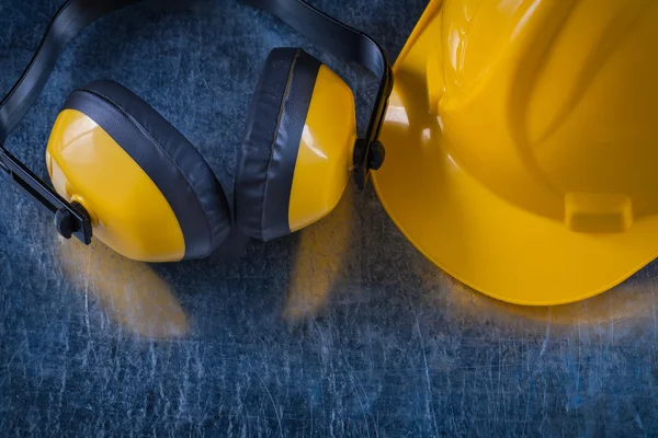 Yellow headphones and building helmet — Stock Fotó
