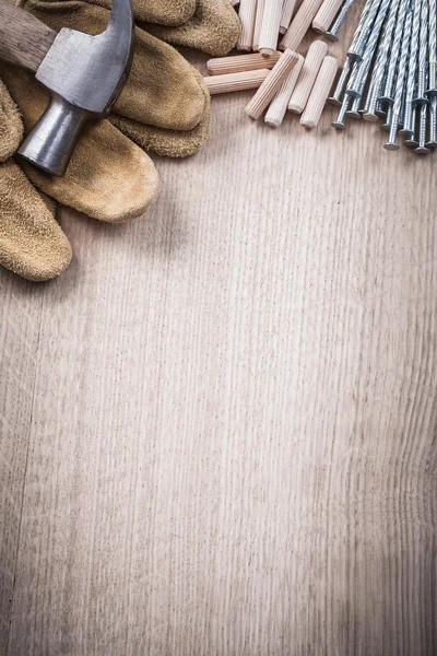 Wooden dowels, hammer, gloves and nails — Stok fotoğraf
