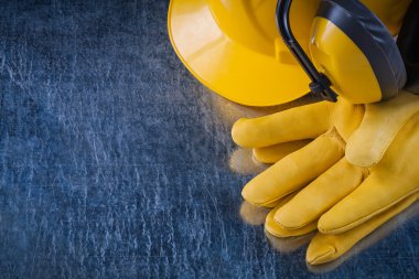 Building helmet, earmuffs and protective gloves