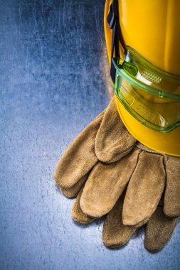 leather gloves, building helmet