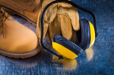 boots, protective gloves and earmuffs