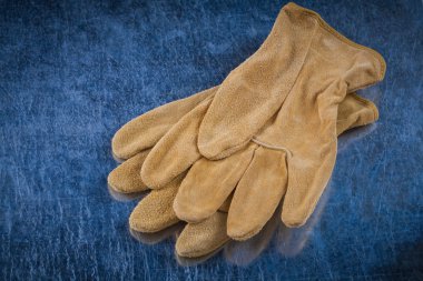 Pair of leather brown protective gloves