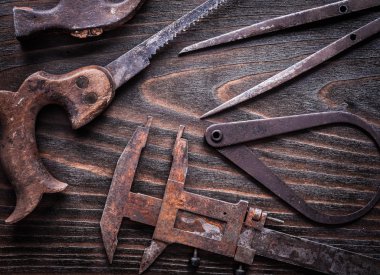 calipers, hand saw and claw hammer