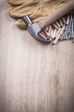 Wooden dowels, claw hammer, gloves