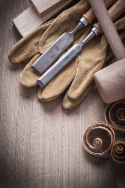 Wooden planks, hammer, working gloves