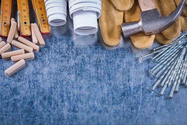 Hammer, gloves, meter, nails and dowels — Stock Photo, Image