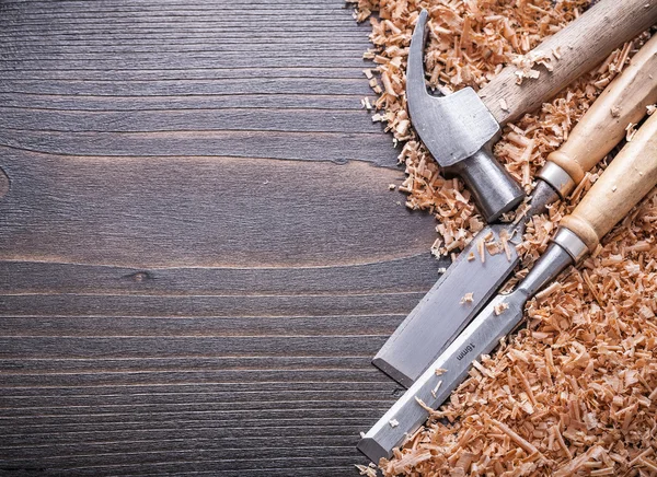 Claw hammer and metal flat chisels — Stock Photo, Image