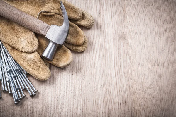 Hammer, safety gloves and nails — Stock Photo, Image