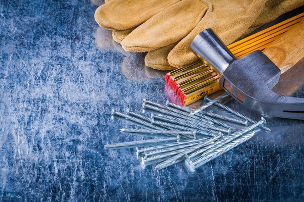 Gloves, nails, wooden meter and hammer — Stock Photo, Image