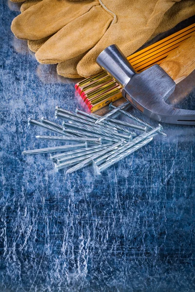 Gloves, nails, wooden meter and hammer — Stock Photo, Image