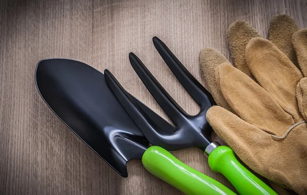 gardening gloves, spade and trowel fork