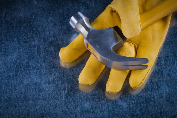 Leather protective glove with hammer — Stock Photo, Image