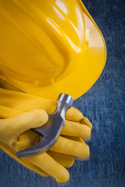 Safety gloves, building helmet and hammer — Stok fotoğraf