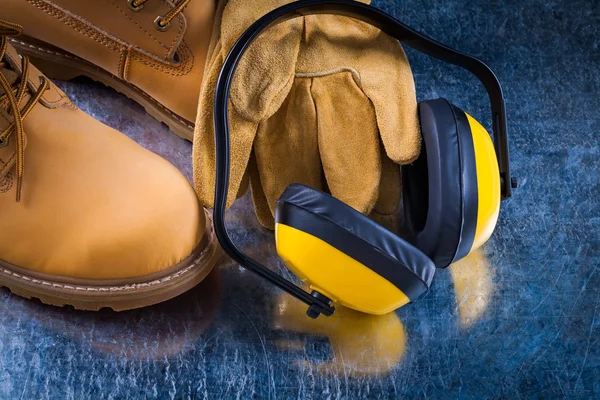 Boots, protective gloves and earmuffs — Stockfoto