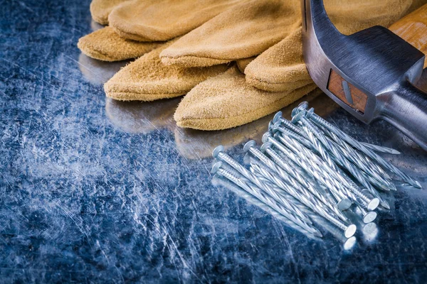 Safety gloves, nails and claw hammer — Stock Photo, Image