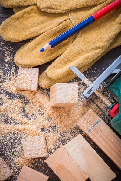Pencil, electrical sawdust, protective gloves — Stock Photo, Image