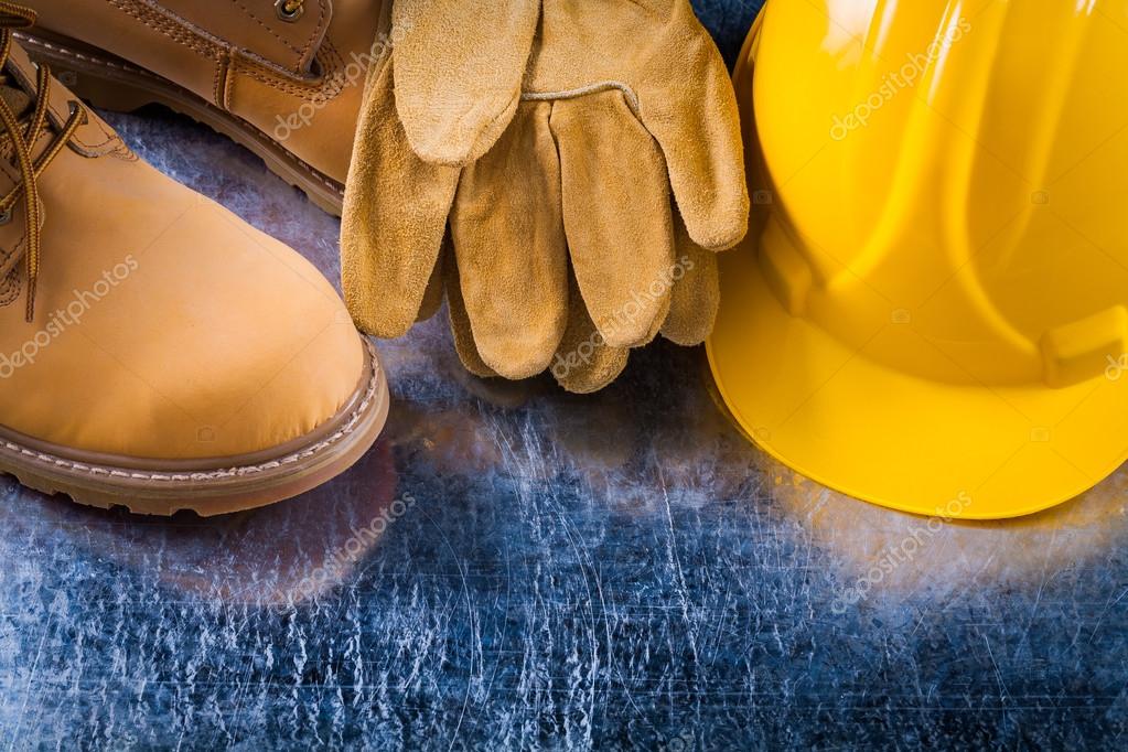 Boots, protective gloves and hard hat Stock Photo by ©mihalec 80368000