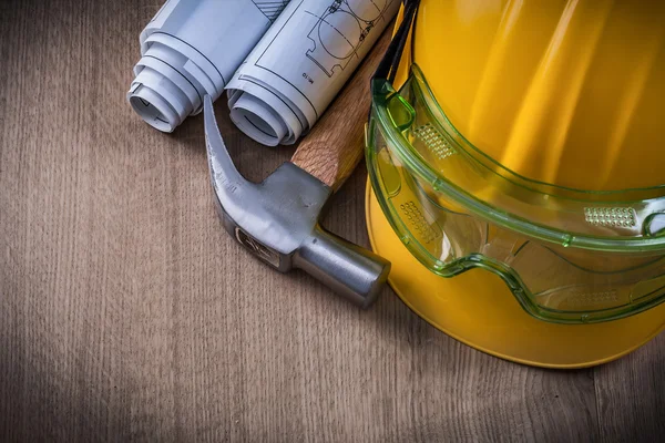 Hammer, goggles, drawings and hard hat — Stock Photo, Image