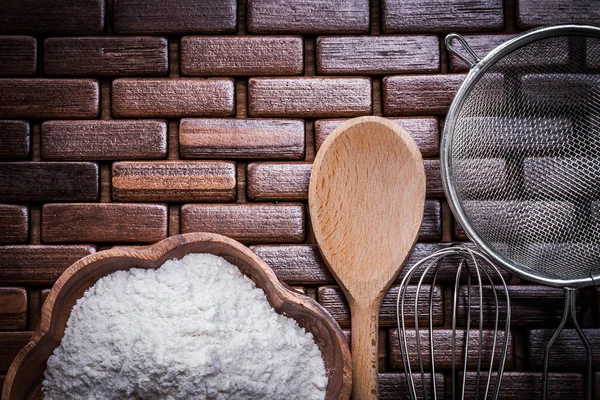 Spoon, bowl with flour, sieve — Stock Photo, Image