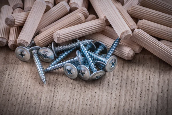 Woodworking dowels and construction nails — Stock Image Woodworking dowels and construction nails Stock Photo