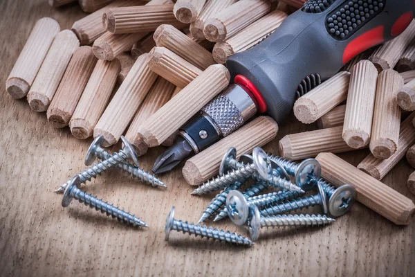 Dowels, construction nails, insulated turnscrew — Stock Image Dowels, construction nails, insulated turnscrew Stock Picture