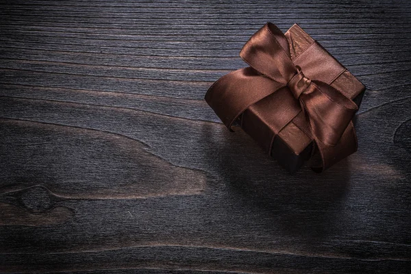 Boxed gifts with brown bow — Stock Photo, Image