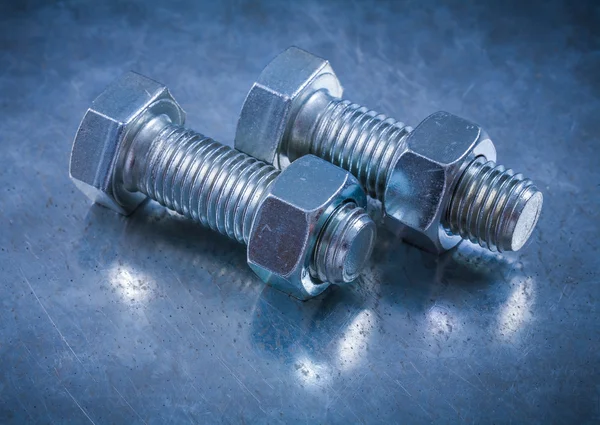 Threaded bolts and construction nuts — Stock Photo, Image