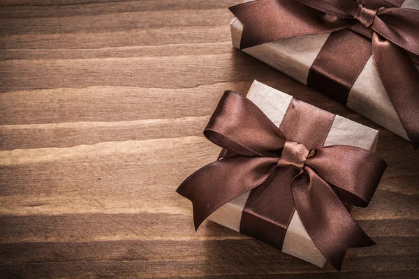 Present containers with brown ribbons — Stock Photo, Image