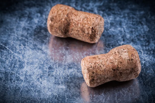 Champagne corks on scratched metallic background — Stock Photo, Image