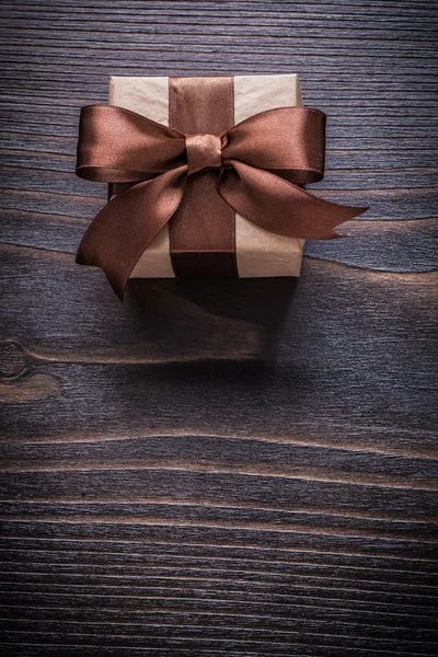 Present box on vintage wooden board — Stock Photo, Image