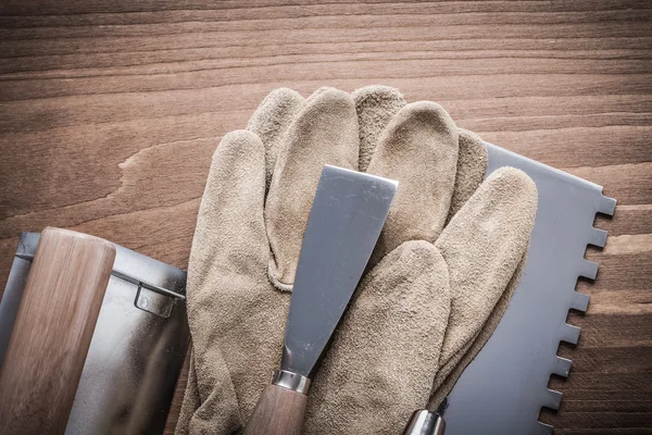 Paintscraper working gloves putty knife — Stock Image Paintscraper working gloves putty knife Royalty Free Stock Images