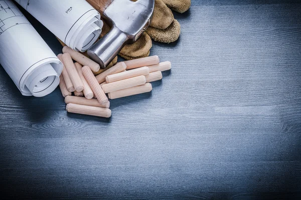 Rolled blueprints wooden dowels — Stock Image Rolled blueprints wooden dowels Stock Picture