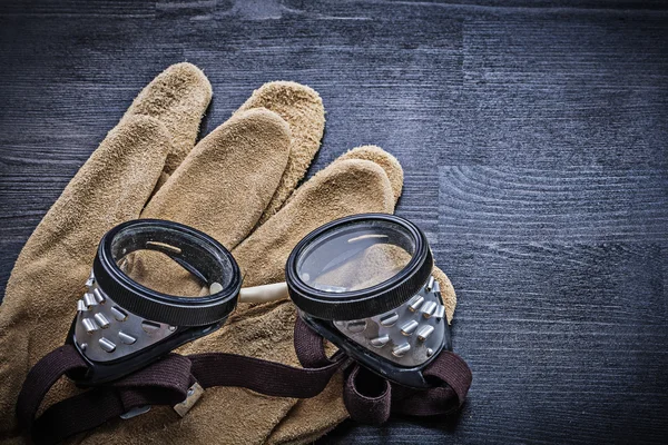 Close-up of goggles on gloves — Stock Photo, Image