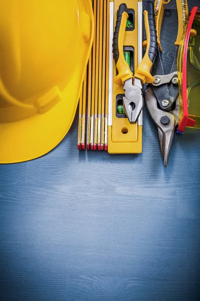 Gloves and building helmet — Stock Photo, Image