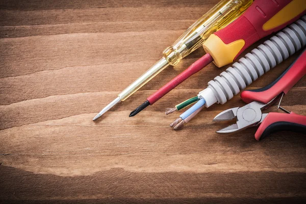 Insulated screwdrivers and corrugated pipe — Stock Photo, Image