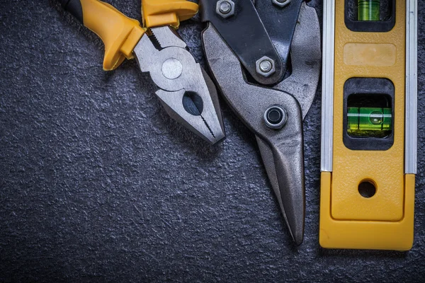 Pliers and construction level — Stock Photo, Image