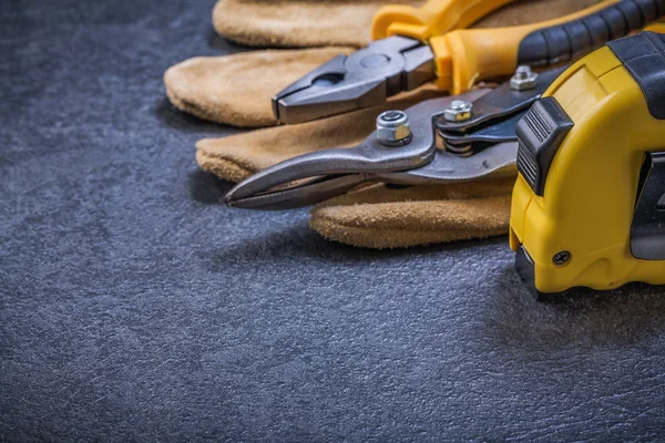 Safety glove and tape measure — Stock Photo, Image