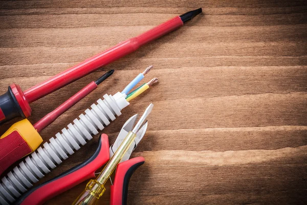 Cutting pliers and insulated screwdriver — Stock Photo, Image